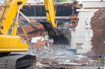 Services excavator demolishes brick building scattering 600nw 2538826261 (1)